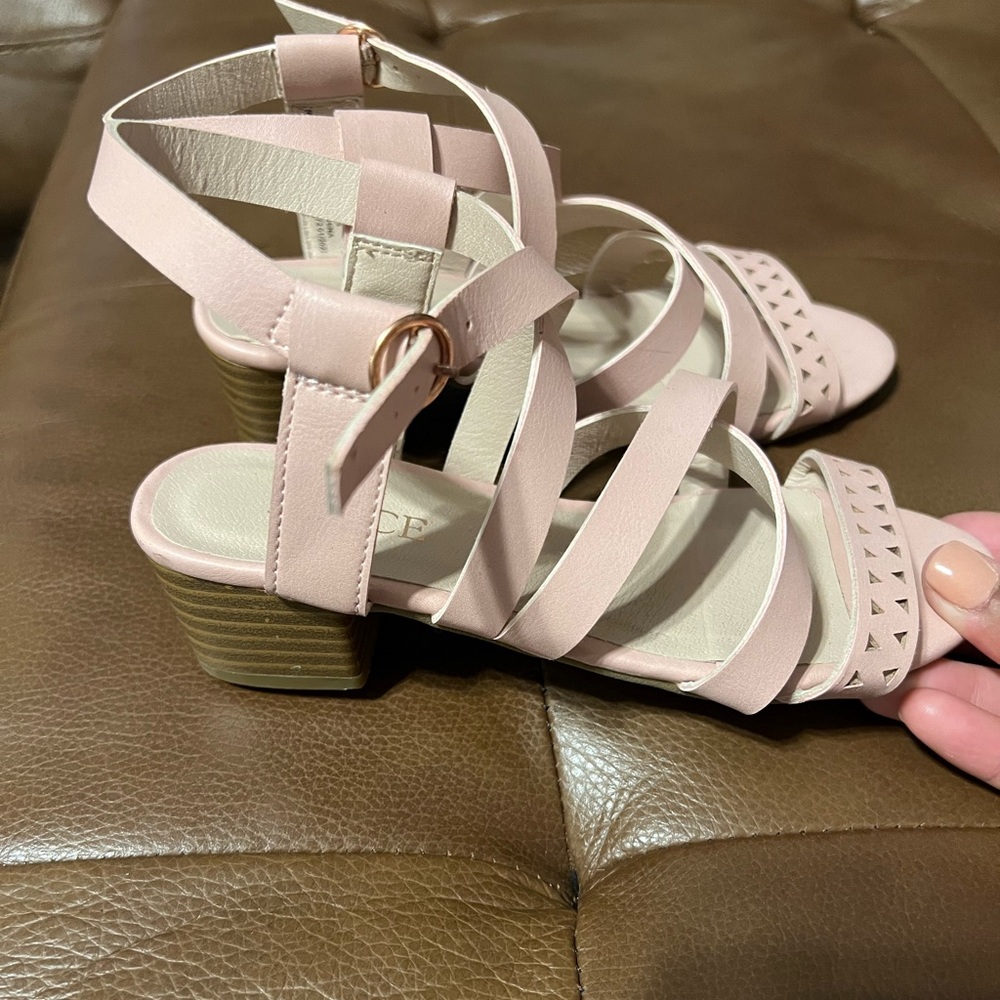 Children place sandals